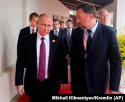 Бизнесмен Олег Дерипаска и российский президент Владимир Путин.