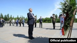 OSCE chairman Didier Burkhalter (center) visits the Armenian Genocide Memorial in Yerevan on June 4. 