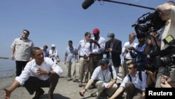 U.S. President Barack Obama, seen here surveying the damage a week ago, said he's "furious" and blamed BP for failing to respond quickly enough.