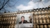 A banner with a giant portrait of jailed Iranian lawyer Nasrin Sotoudeh is seen on the headquarters of the French National Bar Council, demanding her release, in Paris, March 28, 2019