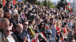 Crowds gather to watch the parade in Minsk.