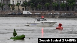 A police boat takes part in search operations for survivors in Budapest on May 30.