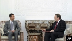 President Bashar al-Assad meets with senior Russian envoy Mikhail Bogdanov in Damascus on August 29.