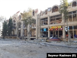 Rocket damage to a shopping center in Ganca