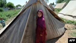 FILE: Hundreds of thousands of vulnerable Pakistanis depend on aid groups for essential services.