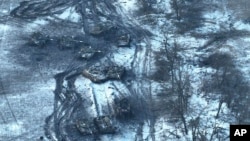 In an image supplied by the Ukrainian military, damaged Russian tanks are seen in a field after attempting to attack Vuhledar earlier this month.