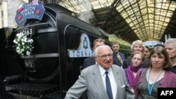 Sir Nicholas Winton meets with evacuees from Nazi-occupied Czechoslovakia 70 years ago, at Liverpool Street Station, in London in 2009. 