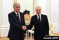 Vladimir Putin (right) greets current Kazakh President Qasym-Zhomart Toqaev in Moscow earlier this year.