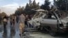 The remains of a minivan after one of two bombings in Kabul claimed by the local affiliate of Islamic State 