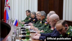 Oligarch Yevgeny Prigozhin (in the dark suit at bottom right) at the meeting in Moscow on November 7