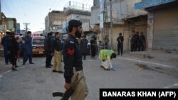 FILE: Pakistani police guard the site of a shooting incident in Quetta. 