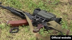 Armenia/Karabakh - An assault rifle with a night-vision scope allegedly left behind by Azerbaijani soldiers during a firefight with Karabakh Armenian forces, 19 Mar2015