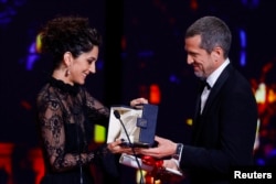 Zar Amir Ebrahimi, who lives in exile in France, accepting the Best Actress award at Cannes.