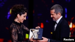 Iranian actress Zar Amir-Ebrahimi receives the Best Actress award for her role in the film Holy Spider at the Cannes Film Festival on May 28.
