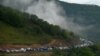 Vehicles carrying refugees from Nagorno-Karabakh queue on the road leading towards the Armenian border, September 25, 2023. 
