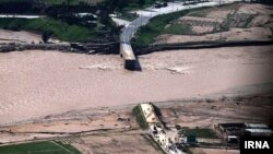 Floods in Iran's Lorestan Province swept away a road bridge in early April.