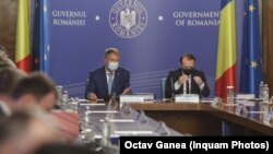 Președintele Klaus Iohannis și Florin Cîțu, atunci în funcția de premier, la ședința de Guvern din 14 iulie 2021.