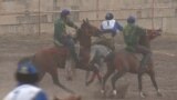 Kyrgyzstan - Kyrgyz riders competed in a championship game of kok-boru, in which competitors battle to drag a goat's carcass toward their opponent's goal. screen grab