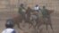 Kyrgyzstan - Kyrgyz riders competed in a championship game of kok-boru, in which competitors battle to drag a goat's carcass toward their opponent's goal. screen grab