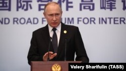 Russian President Vladimir Putin speaks to reporters following the Belt and Road Forum in Beijing on April 27.