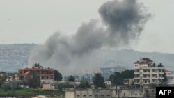 Smoke rises from the site of an Israeli airstrike that targeted the southern Lebanese village of Kfar Tibnit on April 15.