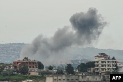 Smoke rises from the site of an Israeli air strike that targeted the southern Lebanese village of Kfar Tibnit on April 15.