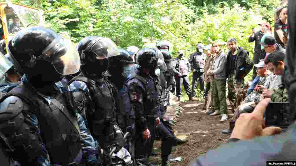 Police face the protesters on August 15.