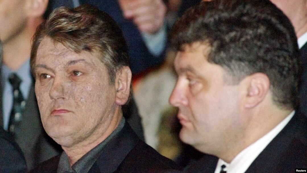 President Viktor Yushchenko (left) and the secretary of the National Defense and Security Council, Petro Poroshenko, attend a party convention in Kyiv in March 2005.
