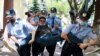 Kazakh police detain a demonstrator in Almaty during a demonstration called by the Democratic Choice of Kazakhstan in June 2020.