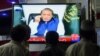 Pakistani men watch a televised address to the nation by Prime Minister Nawaz Sharif in Karachi on April 22.