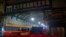 China -- Security guards stand in front of the closed Huanan Seafood Wholesale Market 