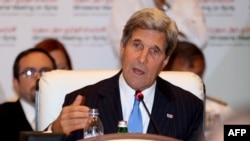 U.S. Secretary of State John Kerry addresses the "Friends of Syria" meeting in the Qatari capital, Doha, on June 22. 