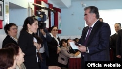 President Emomali Rahmon's (right, voting on March 1) People's Democratic Party, which currently controls 55 of the 63 seats, is widely expected to win by a landslide.