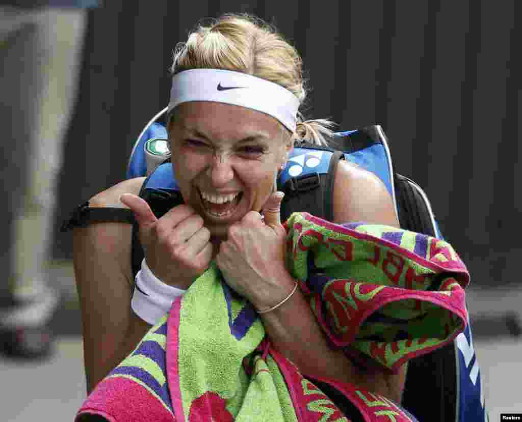 Sabine Lisicki of Germany celebrates after defeating Serena Williams of the United States during their women's singles tennis match at the Wimbledon tennis championships in London. (Reuters/Eddie Keogh)