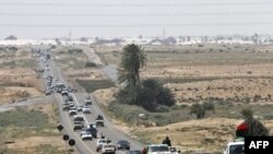 Libya -- Rebels flee from Ras Lanuf to Uqayla, 30Mar2011