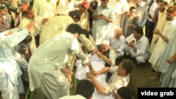 Mourners attend the funeral of a student lynched Over allegations of blasphemy in Pakistan.