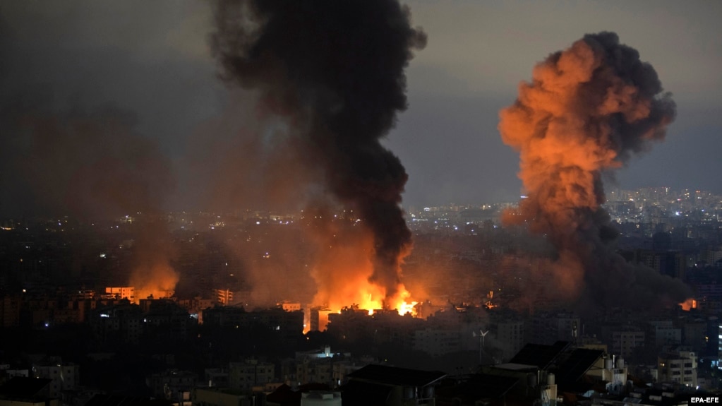 Smoke rises as a result of an Israeli air strike in the Dahieh St. Therese area of Beirut's southern suburbs on October 7. 