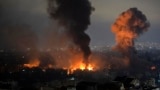 Smoke rises as a result of an Israeli air strike in the Dahieh St. Therese area of Beirut's southern suburbs on October 7. 