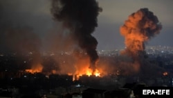 Smoke rises as a result of an Israeli air strike in the Dahieh St. Therese area of Beirut's southern suburbs on October 7. 