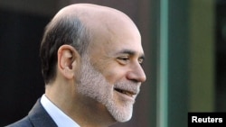 U.S. Federal Reserve Chairman Ben Bernanke takes a brief morning break at the Grand Teton National Park on August 27.