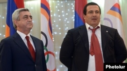 Armenia - President Serzh Sarkisian (L) and Prosperous Armenia Party leader Gagik Tsarukian at an awards ceremony organized by the National Olympic Committee near Yerevan, 26Dec2012.