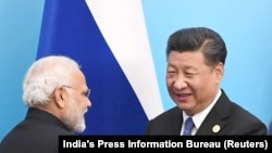 Indian Prime Minister Narendra Modi (left) and Chinese President Xi Jinping (file photo)