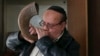 Zablon Simintov, an Afghan Jew, blows the traditional shofar, or ram's horn, at a synagogue in Kabul. (file photo)