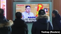 People in Seoul watch a TV broadcasting a news report on North Korean leader Kim Jong Un speaking during a New Year's Day speech on January 1.