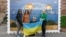 Малюнок у формі великої марки, на якій зображено Керченський міст у вогні. Центр Києва, 8 жовтні 2022 року 