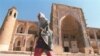 Children play near the ancient walls of the Uzbek city of Khiva.