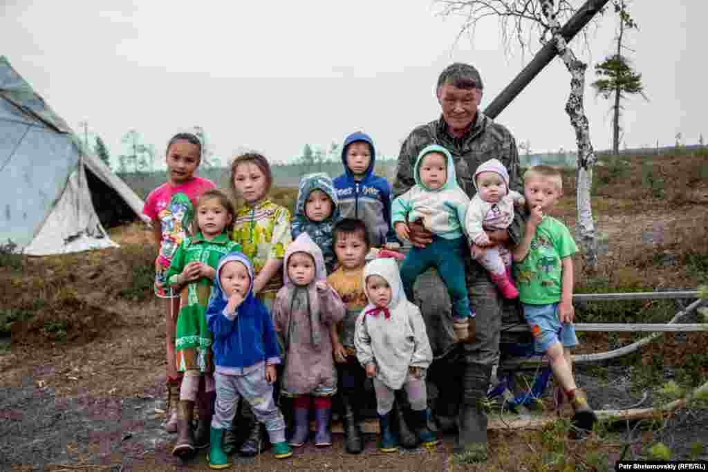 Efim Multanov, the head of the family, and young relatives
