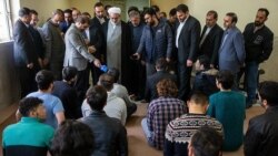 Prosecutor Montazeri facing protesters arrested in November during a visit to a Tehran prison.