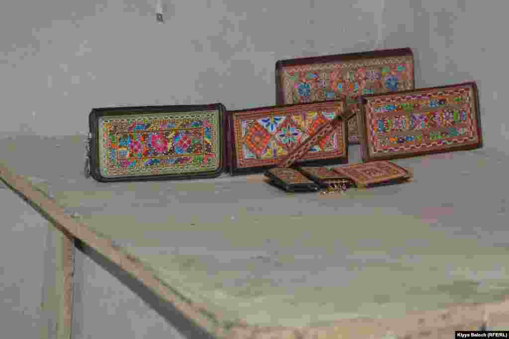 Some of the purses and key chains that artisan Qazi Farhad is able to sell again.