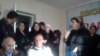 A screen grab of a video showing a group of women disrupting an opposition party's press conference in Dushanbe.